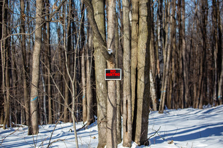 No hunting sign nailed to a Wisconsin tree, horizontal