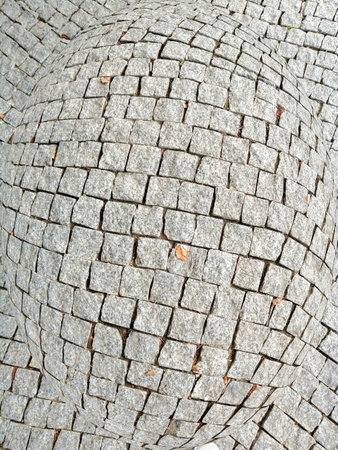 Cobblestone pavement in the city park. Abstract background for design.の写真素材