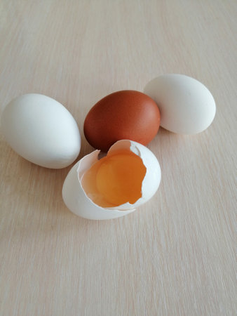 Eggs on a wooden table with space for text. top viewの写真素材