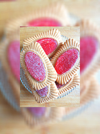 Colorful heart shaped cookies on a wooden table. Toned.の写真素材