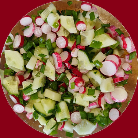 Top view of a bowl of radish and cucumber salad.の写真素材