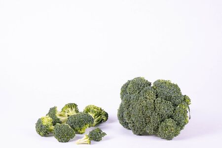 ripe broccoli lies on a table on a white background