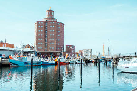 sea harbor with yachts and fishing boats in it in the morningのeditorial素材
