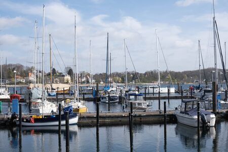 yachts stand at the port in a European city in the morning