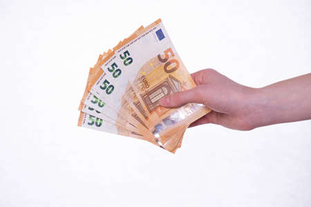 hand holds money euro bills, isolate on white background