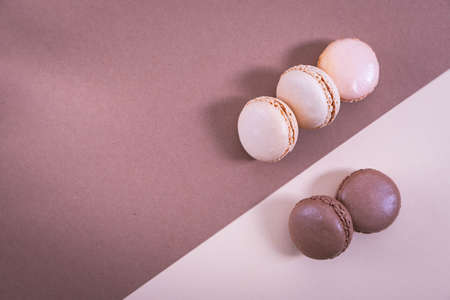 macarons on a paper background, brown and beige background, pastel colorsの写真素材