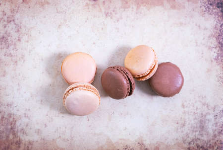 macarons on paper background in vintage style, pastel colorsの写真素材