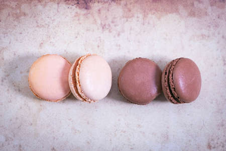 macarons on paper background in vintage style, pastel colorsの写真素材