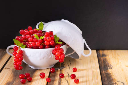ripe fragrant currants in a white bowl