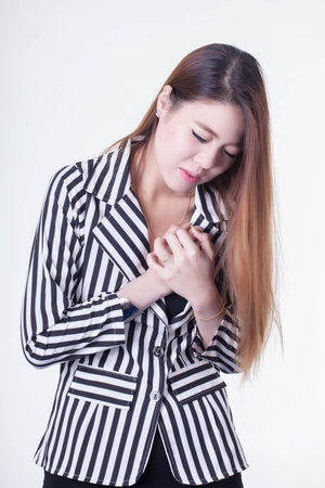 young businesswoman having heart attack の写真素材