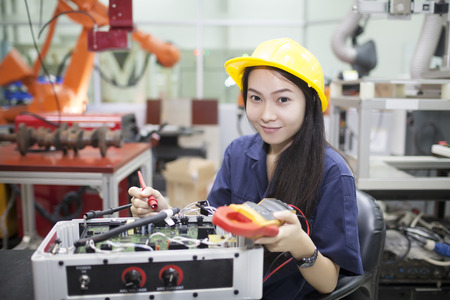 Young scientist tests electronic equipment  in laboratory