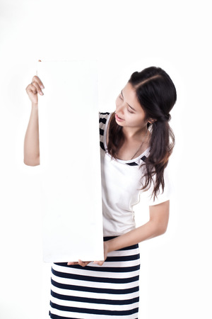Woman holding a blank billboard  Ready to add text  Isolated over white background の写真素材