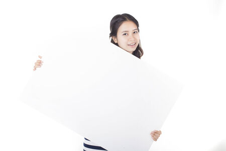 Woman holding a blank billboard  Ready to add text  Isolated over white background の写真素材