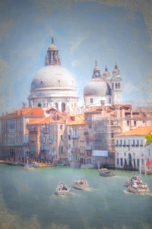 A view of the canal , boats and buildings in Veniceの写真素材