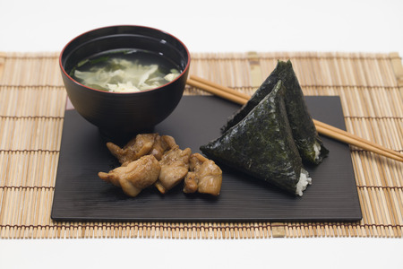 Rice ball with teriyaki chickenの写真素材