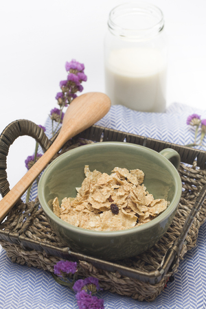 Breakfast of cornflakes, milk on the tableの写真素材