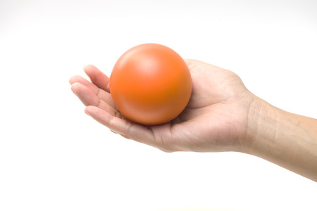 Hand squeezing a stress ballの写真素材