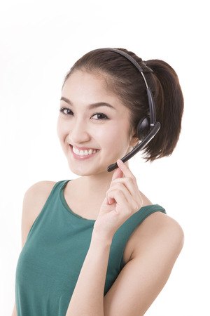 Asian women call center with phone headset with white backgroundの写真素材