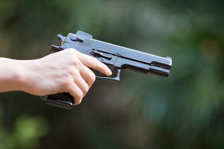 the gun in hand