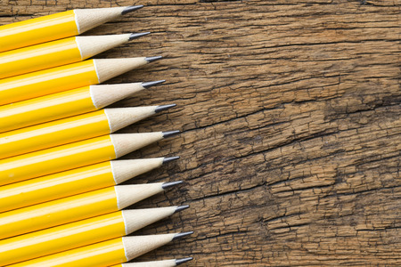 yellow pencils on wooden backgroundの写真素材