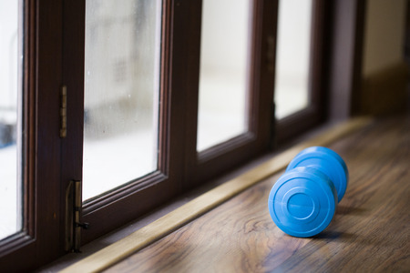 dumbbell beside a doorの写真素材