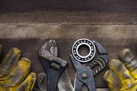 Old tools on a wooden tableの写真素材