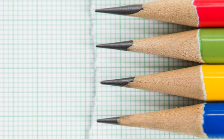 close-up colorful pencils on graph paperの写真素材