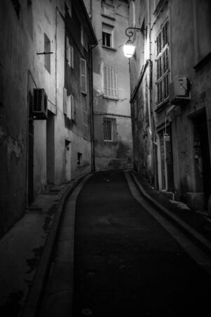 Dark alley in old part of European cities at nightの写真素材