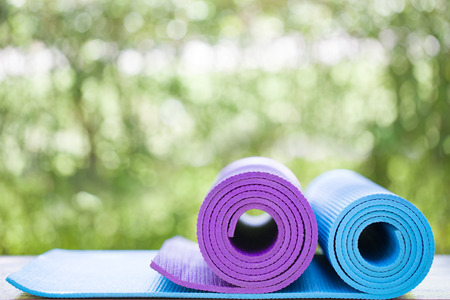 yoga mats on the table in a gardenの写真素材
