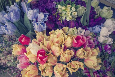 a lot of artificial flower in the market, vintage style