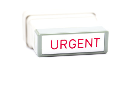 close up urgent rubber stamp on a white backgroundの写真素材