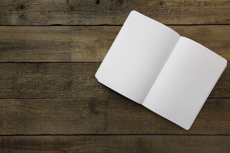 A book on wood table backgroundの写真素材