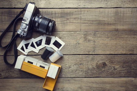 Retro camera on wood table backgroundの写真素材