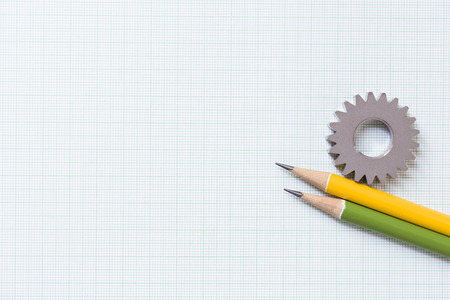Gear and pencils on graph paper,concept and ideaの写真素材