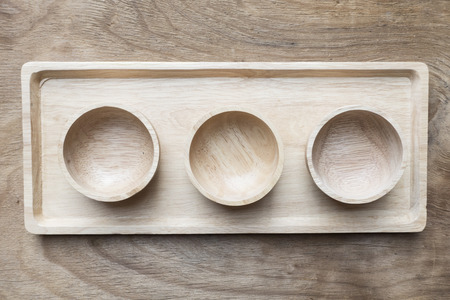 empty wooden bowls on wood tableの写真素材