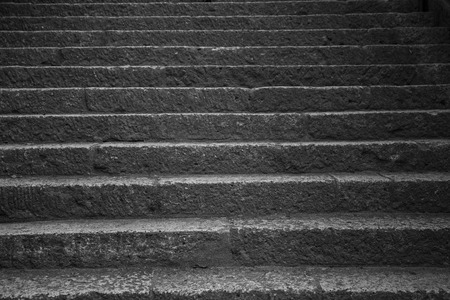 Old stone steps leading up a dark alleyway