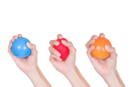 Hands of a woman squeezing a stress ballの写真素材