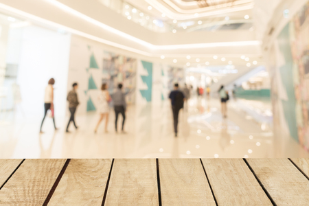 Empty top of wooden table and supermarket blur backgroundの写真素材