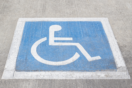 Disability symbol painted on the floorの写真素材