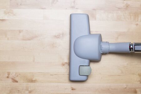 Vacuum cleaning on the parquet floorの写真素材