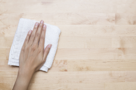 Cleaning table by woman handの写真素材