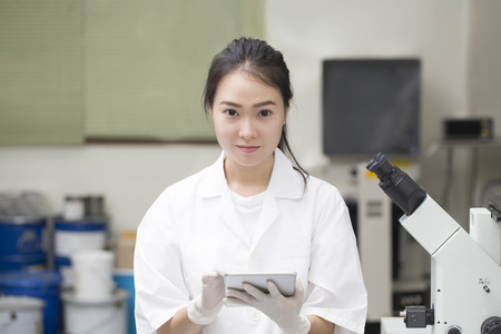 Scientist doing chemical test in laboratoryの写真素材