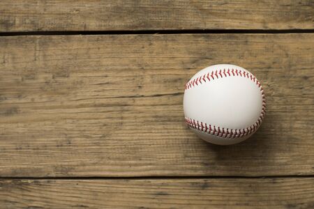 baseball on old brown and vintage table backgroundの写真素材