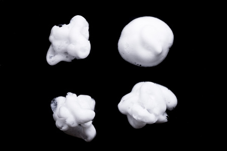 Shave foam or cream isolated on black backgroundの写真素材