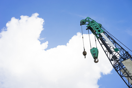 Hoist/crane with blue sky and cloud in backgroundの写真素材