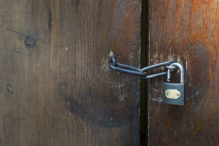 Locked old wooden doorの写真素材