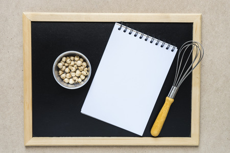 Food ingredients ,kitchen utensils, notebook and blackboard for cookingの写真素材