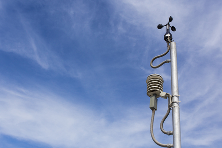 Anemometer in a farm with blue sky