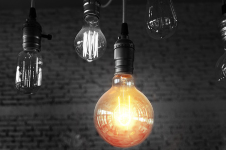 light bulbs on a black and white background, concept and idea