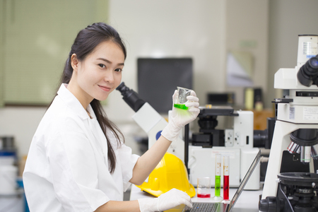 Scientist doing chemical test in laboratoryの写真素材